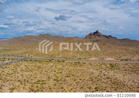 Panoramic view of peak mountains ranges near a road in Arizona Panoramic view of peak mountains ranges near a road in Arizona 81110098