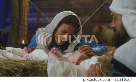 Mary talking with baby Jesus near Joseph Mary talking with baby Jesus near Joseph 81110164