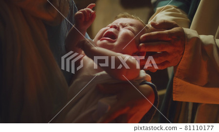 Mary and Joseph comforting crying baby Jesus Mary and Joseph comforting crying baby Jesus 81110177