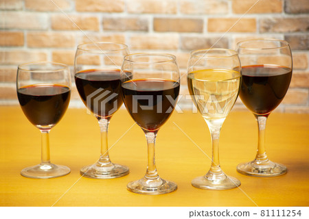 Wine glasses lined up at the counter Wine glasses lined up at the counter 81111254