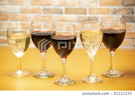 Wine glasses lined up at the counter Wine glasses lined up at the counter 81111255
