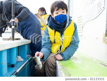 Elementary school boys enjoying fishing Elementary school boys enjoying fishing 81115331