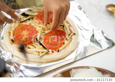 Children's hands making pizza Children's hands making pizza 81117130
