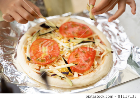 Children's hands making pizza Children's hands making pizza 81117135