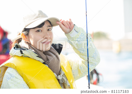 Cute woman enjoying fishing 81117183