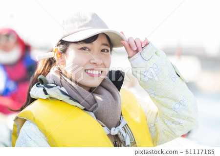 Cute woman enjoying fishing 81117185