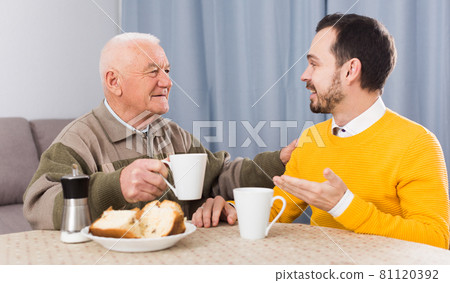 Father and son enjoying evening 81120392