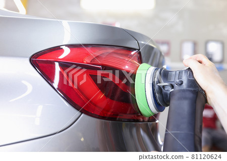 Detailing and polishing of car tail light on car closeup Detailing and polishing of car tail light on car closeup 81120624