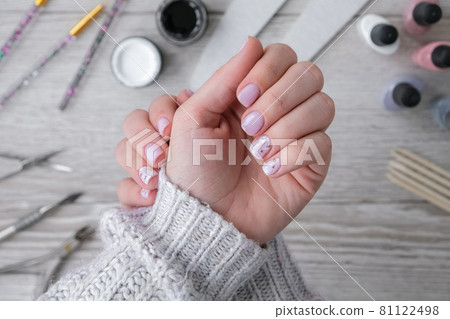 Modern female nude design manicure. Nail care, Self care. Professional Hardware Manicure. Procedure for the preparation of nails. Cuticle Pusher Remover. Nail file scissors Modern female nude design manicure. Nail care, Self care. Professional Hardware Manicure. Procedure for the preparation of nails. Cuticle Pusher Remover. Nail file scissors 81122498