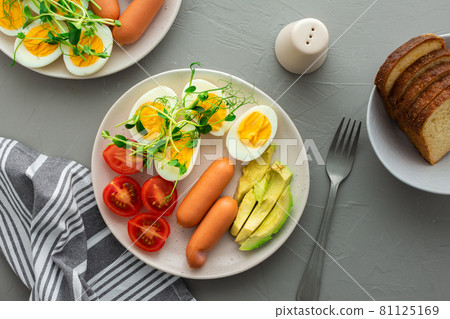 Lunch with boiled eggs with sausages 81125169