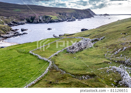 Abandoned village at An Port between Ardara and Glencolumbkille in County Donegal - Ireland. Abandoned village at An Port between Ardara and Glencolumbkille in County Donegal - Ireland. 81126651