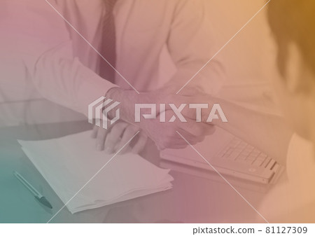 Composition of colorful light over business people shaking hands Composition of colorful light over business people shaking hands 81127309