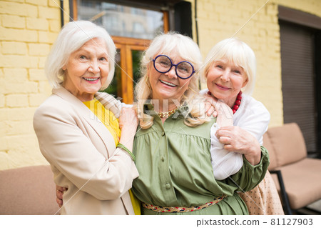 Three ssweet senior ladies looking happy spedning time together Three ssweet senior ladies looking happy spedning time together 81127903