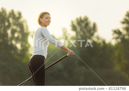 Close-up portrait of young Caucasian woman, sportsman practicing, training alone at summer evening, outdoors. Active life, sport, leisure activity concept 81128798