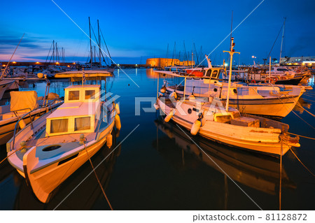 Venetian Fort in Heraklion and moored fishing boats, Crete Island, Greece Venetian Fort in Heraklion and moored fishing boats, Crete Island, Greece 81128872