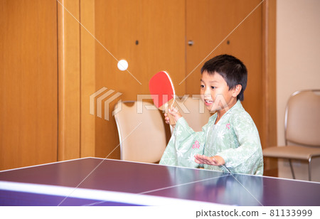 Boy playing table tennis in a hot spring 81133999