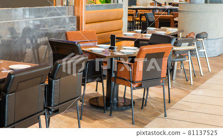 Simple table and chair set in a restaurant 81137525