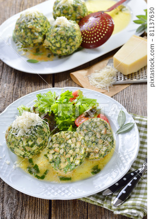 Tyrolean spinach dumplings with salad Tyrolean spinach dumplings with salad 81137630