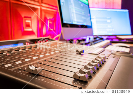 close up audio mixing console fader in home recording studio. music background. recording and broadcasting concept close up audio mixing console fader in home recording studio. music background. recording and broadcasting concept 81138949