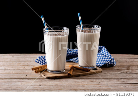 Fresh horchata with cinnamon in glass Fresh horchata with cinnamon in glass 81139375