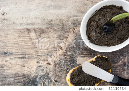 Black olive tapenade with anchovies, garlic and olive oil Black olive tapenade with anchovies, garlic and olive oil 81139384