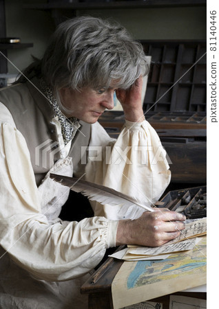 Hartlepool, U.K - July 27, 2021: The National Museum of The Royal Navy , in the North of England. The wax figure of a writer, a printing worker Hartlepool, U.K - July 27, 2021: The National Museum of The Royal Navy , in the North of England. The wax figure of a writer, a printing worker 81140446