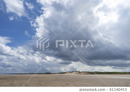 North Sea at the Crimdon beach, Hartlepool and Seaton Carew, England. Dark blue sky and sandy beach in United Kingdom 81140453