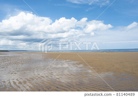 North Sea at the Crimdon beach, Hartlepool and Seaton Carew, England. Dark blue sky and sandy beach in United Kingdom North Sea at the Crimdon beach, Hartlepool and Seaton Carew, England. Dark blue sky and sandy beach in United Kingdom 81140489