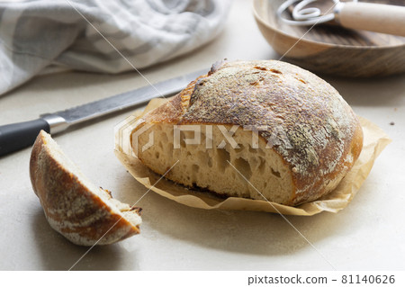 Sourdough rustic bread loaf, round homemade bread made from wild yeast. Sourdough rustic bread loaf, round homemade bread made from wild yeast. 81140626