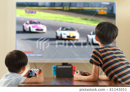 Home video game console screen and boys enjoying it 81143051