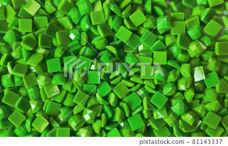Close-up, green square diamonds for diamond embroidery. Hobbies and DIY, materials for creating diamond embroidery Close-up, green square diamonds for diamond embroidery. Hobbies and DIY, materials for creating diamond embroidery 81143337
