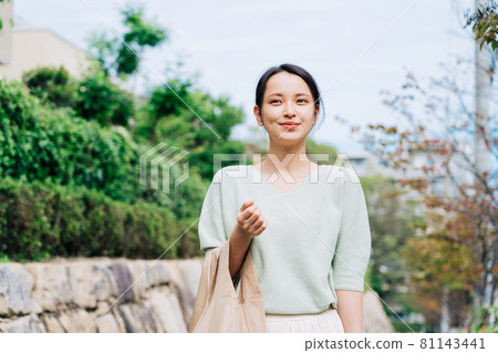 A woman with an eco bag A woman with an eco bag 81143441