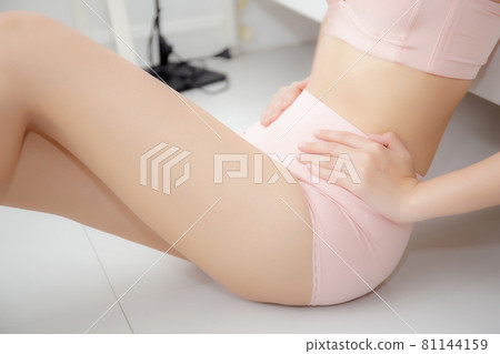 Closeup asian woman wear underwear beautiful body belly slim shape sexy with diet at room. 81144159