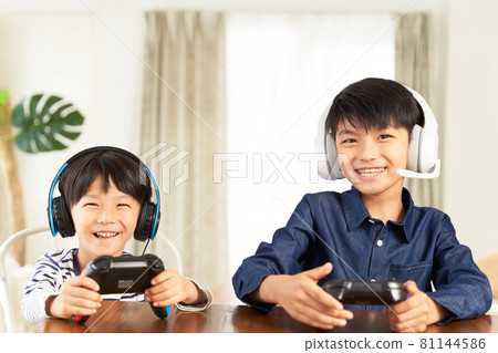 Boy wearing a headset and enjoying video games Boy wearing a headset and enjoying video games 81144586