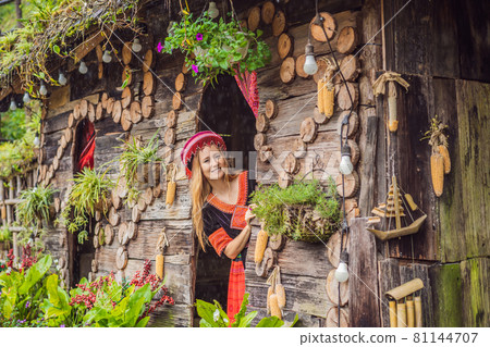 A female tourist dressed in the traditional dress of the inhabitants of the Vietnamese mountains, the Hmong. Woman in Sapa in the fog, Northwest Vietnam. Vietnam travel concept. UNESCO heritage A female tourist dressed in the traditional dress of the inhabitants of the Vietnamese mountains, the Hmong. Woman in Sapa in the fog, Northwest Vietnam. Vietnam travel concept. UNESCO heritage 81144707