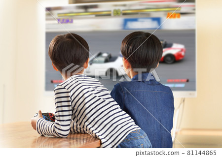 Back view of two boys enjoying video games 81144865