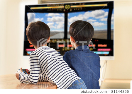 Back view of two boys enjoying video games 81144866