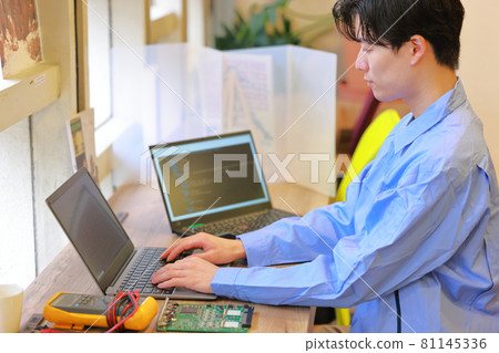 Electrical engineer working on a PC desk 1 Electrical engineer working on a PC desk 1 81145336