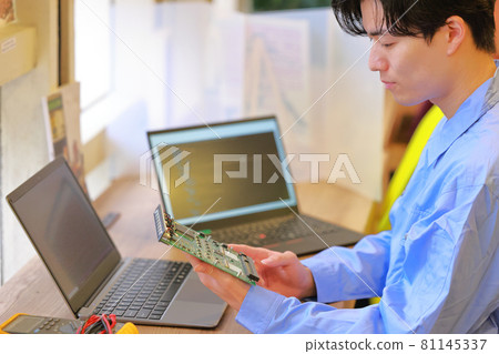 Electrical engineer checking the board 1 Electrical engineer checking the board 1 81145337