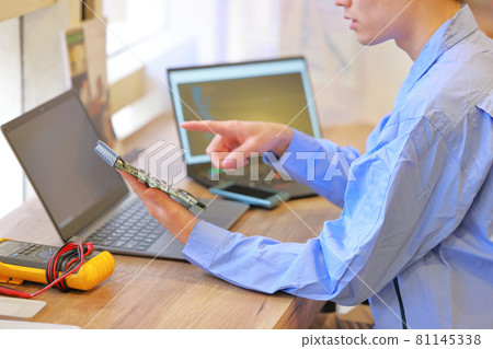 Electrical engineer pointing to the board and checking 1 Electrical engineer pointing to the board and checking 1 81145338