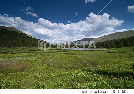 Hassell Lake in Arapaho National Forest, Colorado under summer cloudscape. 81146091