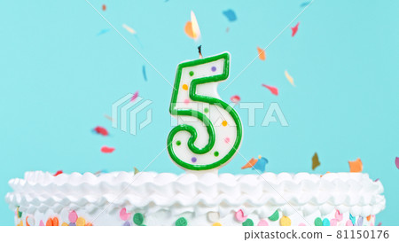 Colorful tasty birthday cake with candles shaped like the number 5. 81150176