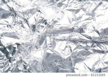 Crumpled foil texture background, silver shiny material. Aluminum, metal backdrop Crumpled foil texture background, silver shiny material. Aluminum, metal backdrop 81151005