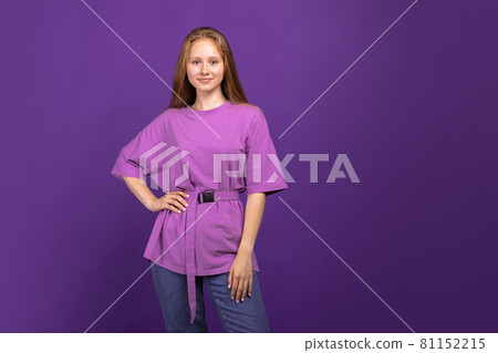 Half-length portrait of young beautiful girl isolated on purple studio background. Concept of human emotions, facial expression, youth, sales, ad. Half-length portrait of young beautiful girl isolated on purple studio background. Concept of human emotions, facial expression, youth, sales, ad. 81152215