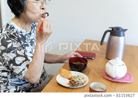 A Japanese senior woman living alone who sits at a table and eats lonely A Japanese senior woman living alone who sits at a table and eats lonely 81153627
