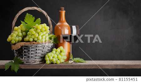 White grape, bottle and red wine glass White grape, bottle and red wine glass 81155451