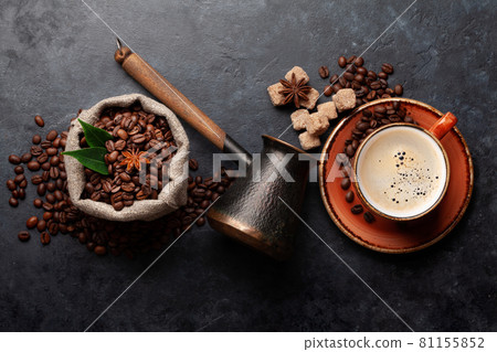 Roasted coffee beans, Turkish jezve, coffee cup and sugar 81155852