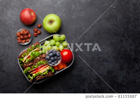 Healthy school lunch box with sandwich and fresh vegetables 81155887