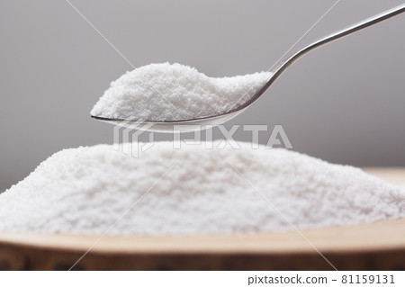 Spoon with natural sweetener stevia on a heap 81159131