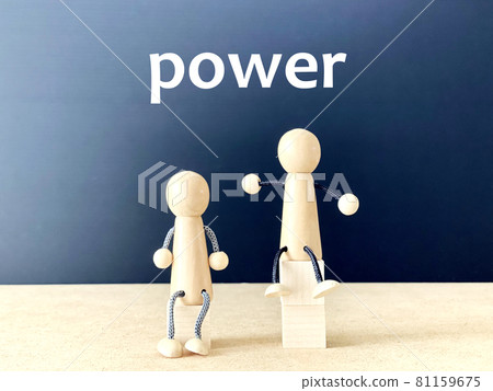 Two dolls sitting in boxes of different heights with _power letters Two dolls sitting in boxes of different heights with _power letters 81159675